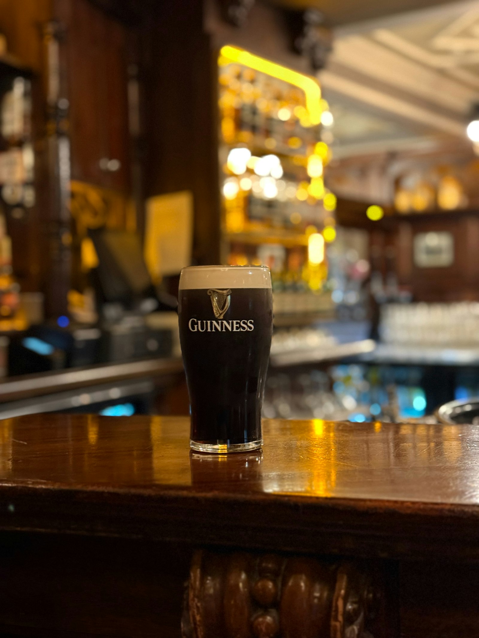 A pint of Guinness on a bar